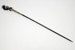 A ladies walking cane with 25cm white metal parasol handle,