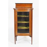 An Edwardian mahogany display cabinet with glazed bow front, set satinwood stringing and edges,