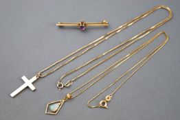 A collection of jewellery to include: A hallmarked 9ct gold cross pendant with chain;