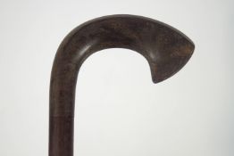 A hardwood walking stick with hardwood handle,