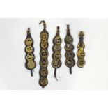 A collection of five leather mounted horse brasses