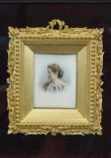 A late 19th century portrait miniature of a Lady in a gilt composite frame with bead edging,