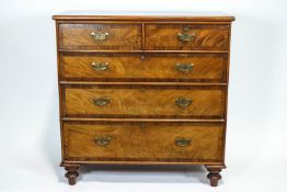 A 19th century mahogany and walnut chest of drawers,