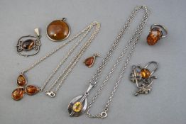 A collection of gem set white metal jewellery to include two necklaces, four pendants and a ring.