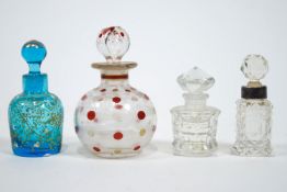 Four glass scent bottles with stoppers,