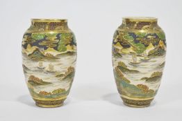 A pair of satsuma style plain baluster vases, decorated with Samurai before a seascape,
