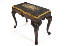 An 18th century style mahogany stool with inset tapestry seat,