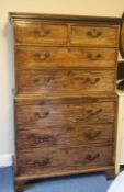 A George III mahogany chest on chest with two short above two long drawers a brushing slide
