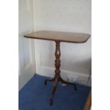 A 19th century mahogany occasional table on turned pedestal, on splayed legs and spade feet,