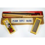 A boxed Pelham puppet lightweight theatre with a curtained proscenium,