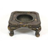 A 19th century Japanese lacquer pot stand (or hibachi), decorated with gilt foliate scrolls,