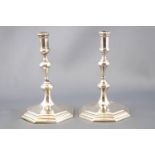A pair of cast Sterling silver George I style taper sticks, of octagonal baluster form,