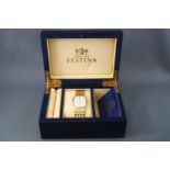 An 18ct yellow gold (stamped) Festina wristwatch. Quartz movement, 18ct gold linked bracelet.