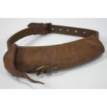 A leather dog message carrying collar,