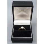 A yellow metal single stone ring. Set with a round brilliant cut diamond of approximately 0.46cts.