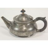 A pewter teapot with ebonised handle and knop, by Liberty & Co,