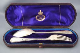 A child's cased silver bead edge pattern dessert spoon and fork, with stipple engraved highlights,