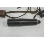 A Cooke & Sons leather and brass three draw telescope, with carry strap and end caps,