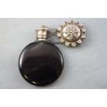 A Victorian circular violet glass scent bottle with cooper patent inset silver-like metal stopper