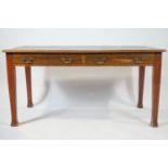 A mahogany library table, the leather inset top frieze drawers on square tapering legs,