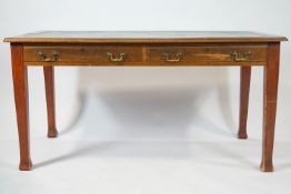 A mahogany library table, the leather inset top frieze drawers on square tapering legs,