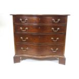 A George III style mahogany chest of four serpentine fronted drawers,