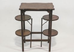 A mahogany occasional table with cake stand ends,