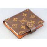A Louis Vuitton signature fabric pocket address book with integral ball point pen, 10.