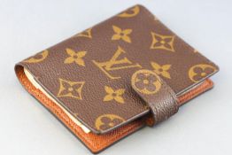 A Louis Vuitton signature fabric pocket address book with integral ball point pen, 10.