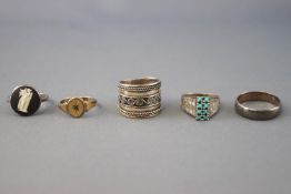 A collection of ten silver rings of variable designs. Size range from I to Q.