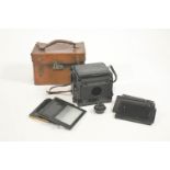 A Marion and Co 'Soho' reflex folding camera, Kershaw patent, with spare plates,