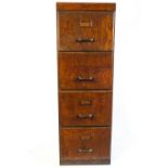 A 1940's oak veneered four drawer filing cabinet,