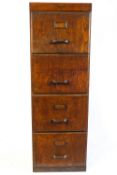 A 1940's oak veneered four drawer filing cabinet,