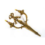 An early 20th century gilt brass two branch wall light with ribbon detail 54.