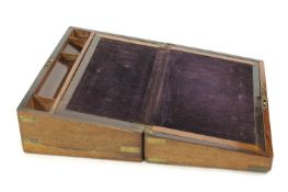 A brass bound rosewood writing slope with secret drawers,