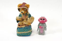 A 'bear feeding a bear' Japanese tin plate battery operated figure,