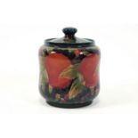 A William Moorcroft cylindrical jar and cover, decorated with the pomegranate pattern,