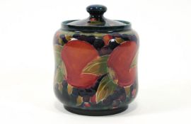 A William Moorcroft cylindrical jar and cover, decorated with the pomegranate pattern,