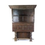 A large,17th century and later oak corner cabinet,