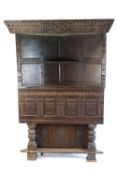 A large,17th century and later oak corner cabinet,