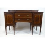 An Edwardian mahogany sideboard, with inverted breakfront,