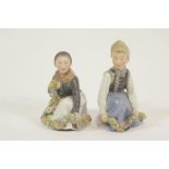 A pair of Royal Copenhagen Amager figures, printed and painted marks, number 12414, 15.