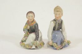 A pair of Royal Copenhagen Amager figures, printed and painted marks, number 12414, 15.