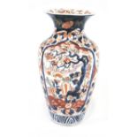 An early 20th century Imari vase, decorated with panels of birds and foliage,