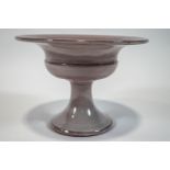 A Fulham Pottery glazed earthenware footed tazza, designed by Constance Spry, signed to base,