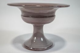 A Fulham Pottery glazed earthenware footed tazza, designed by Constance Spry, signed to base,