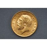 A George V half sovereign coin, dated 1911. 4.