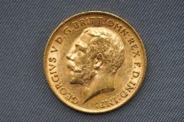 A George V half sovereign coin, dated 1911. 4.