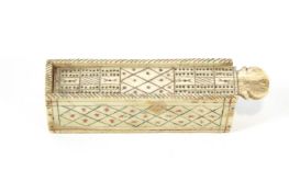 A prisoner of war style bone set of miniature dominoes, in a small rectangular travelling box,