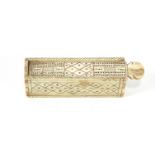 A prisoner of war style bone set of miniature dominoes, in a small rectangular travelling box,